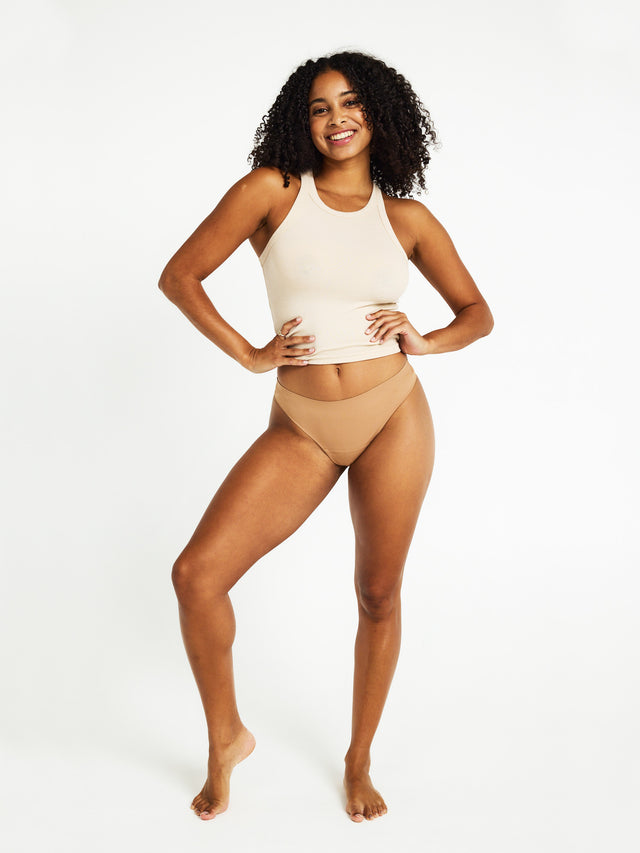 ANTHLMTNYW_MB_Seamfree_Thong_Tawny_65_Model_Cameron_10-S.jpg
